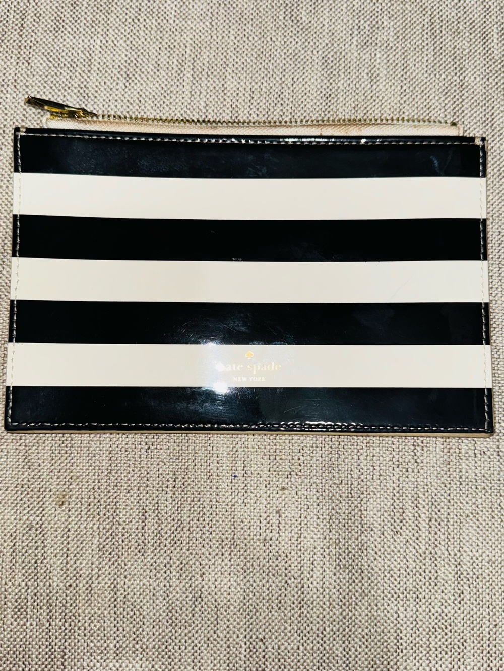kate spade Black and White Striped Patent Zip Pouch